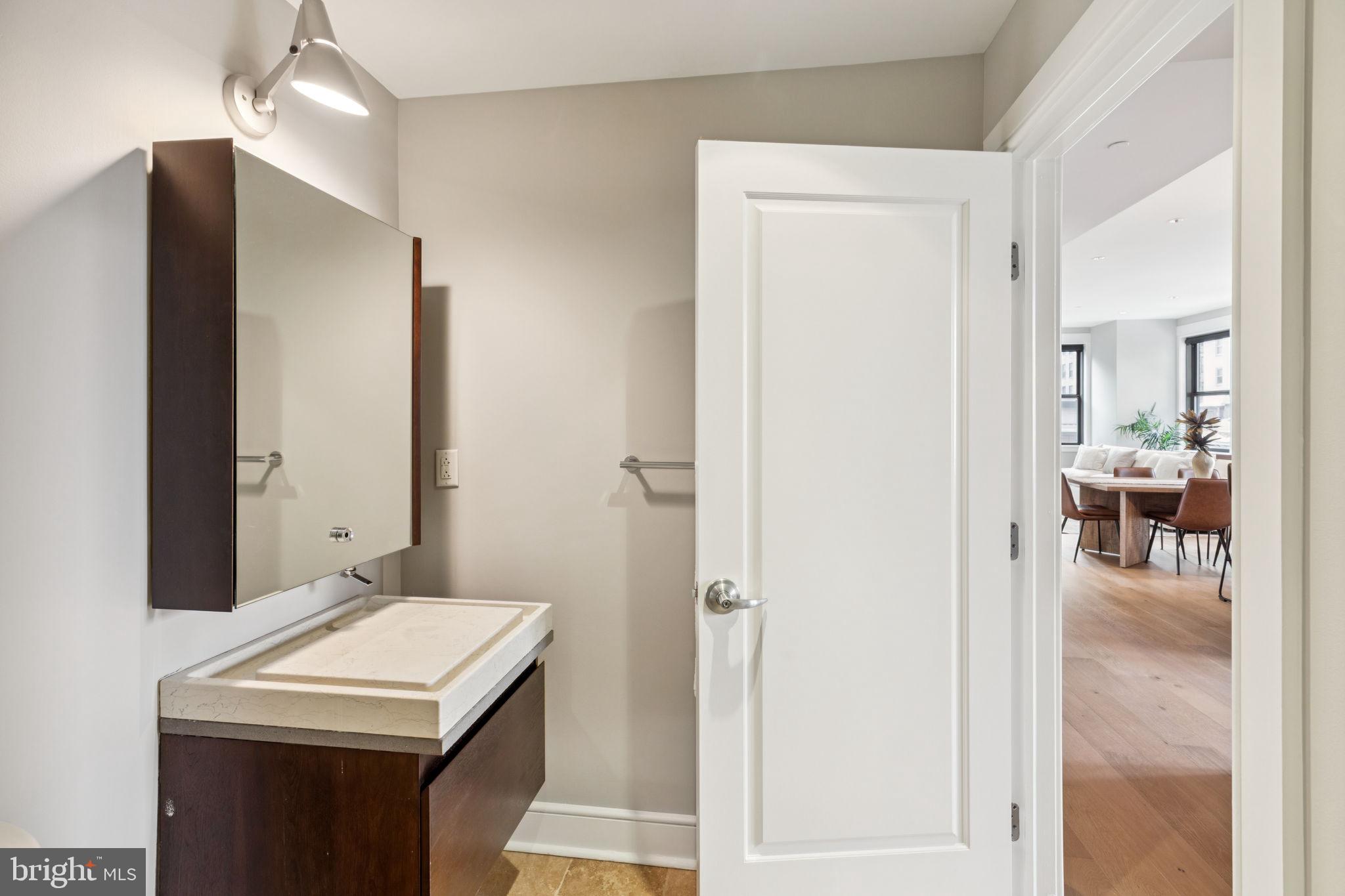 1515 Locust Street, Unit 800 Philadelphia, PA 19102 - Photo 24 of 59 a bathroom with a sink a mirror and a shower