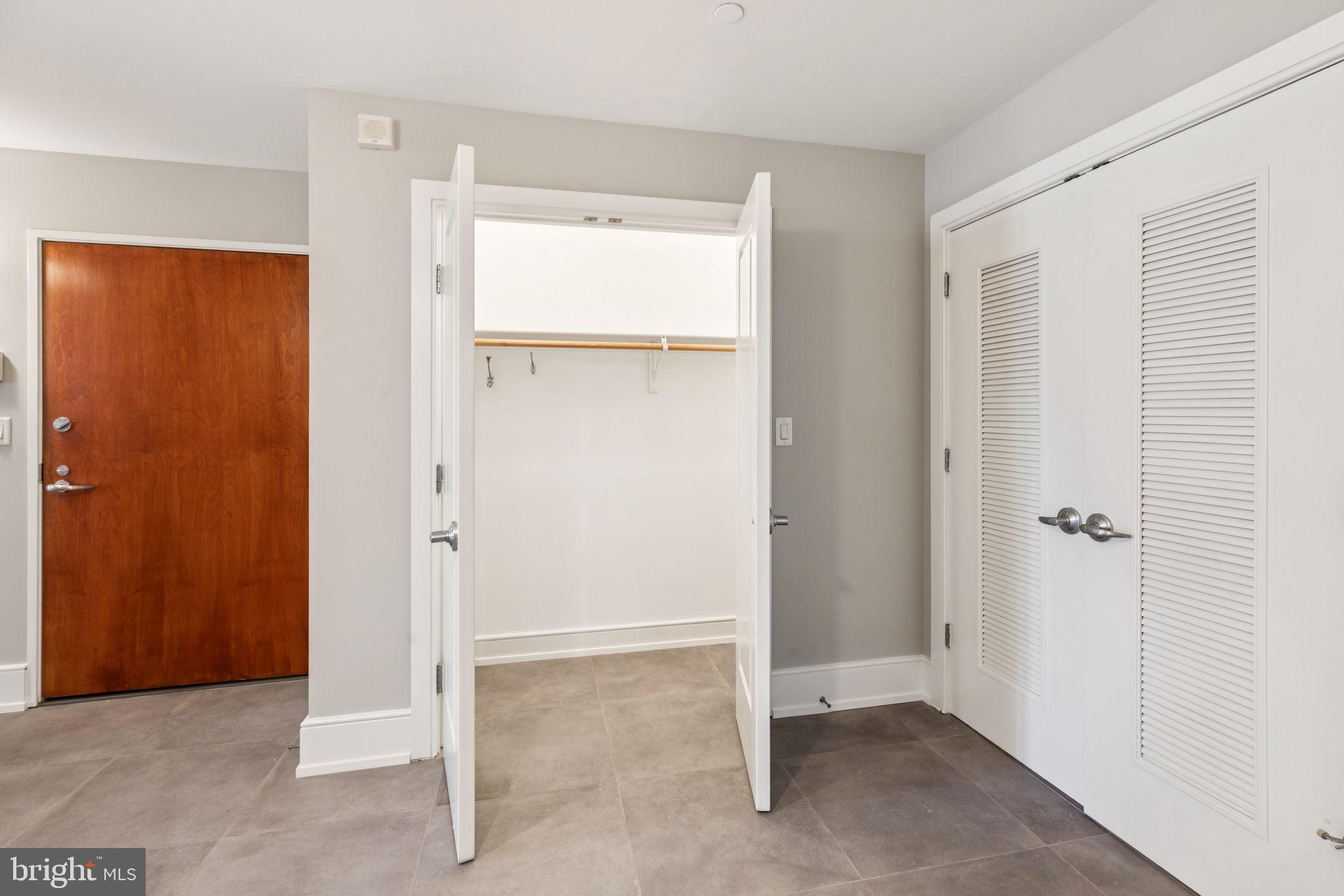 1515 Locust Street, Unit 800 Philadelphia, PA 19102 - Photo 35 of 59 a view of an empty room with closet and a window