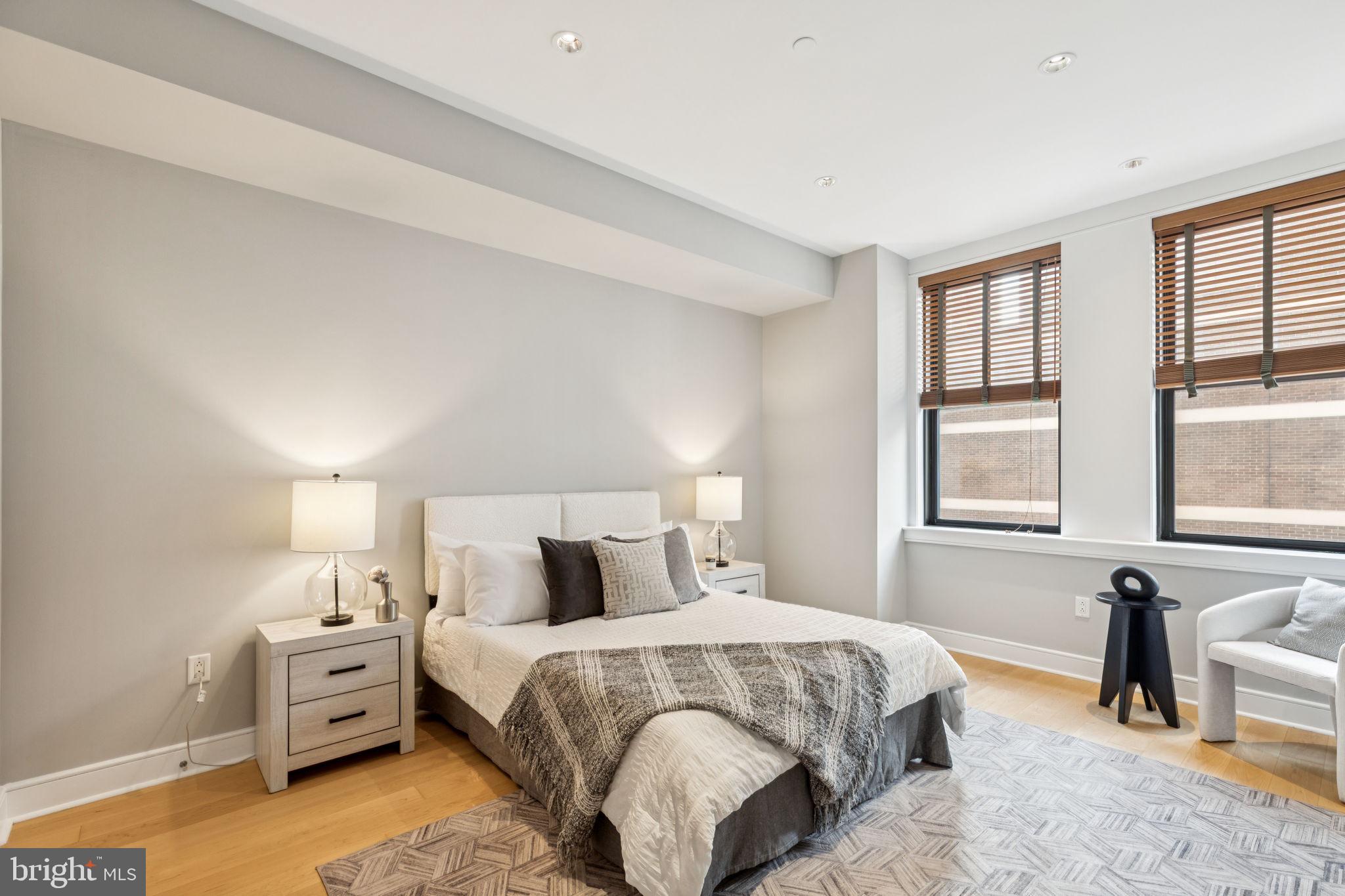 1515 Locust Street, Unit 800 Philadelphia, PA 19102 - Photo 47 of 59 a bedroom with a bed and a large window