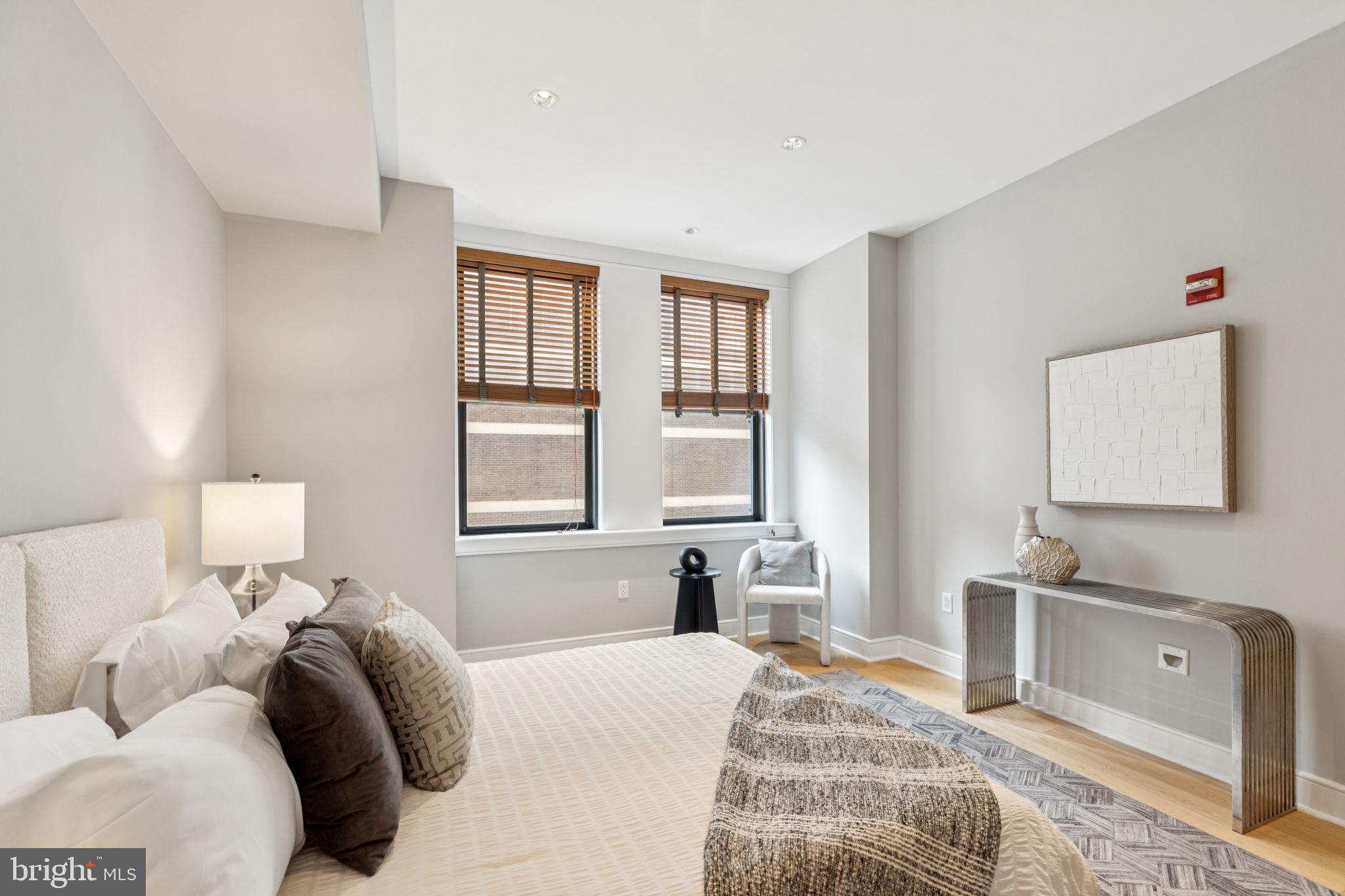 1515 Locust Street, Unit 800 Philadelphia, PA 19102 - Photo 48 of 59 a bedroom with a bed and a night stand