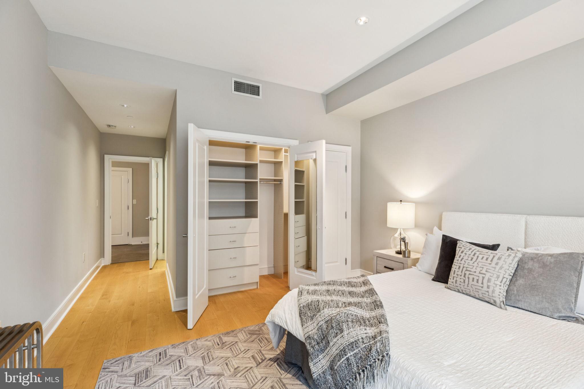 1515 Locust Street, Unit 800 Philadelphia, PA 19102 - Photo 50 of 59 a bedroom with a bed and a walk in closet