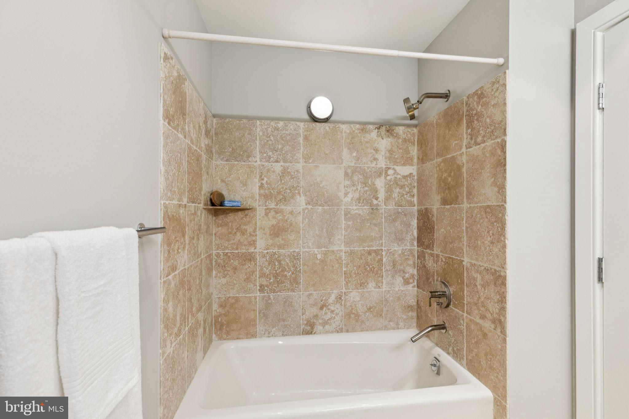 1515 Locust Street, Unit 800 Philadelphia, PA 19102 - Photo 53 of 59 a bathroom with a shower and a bath tub
