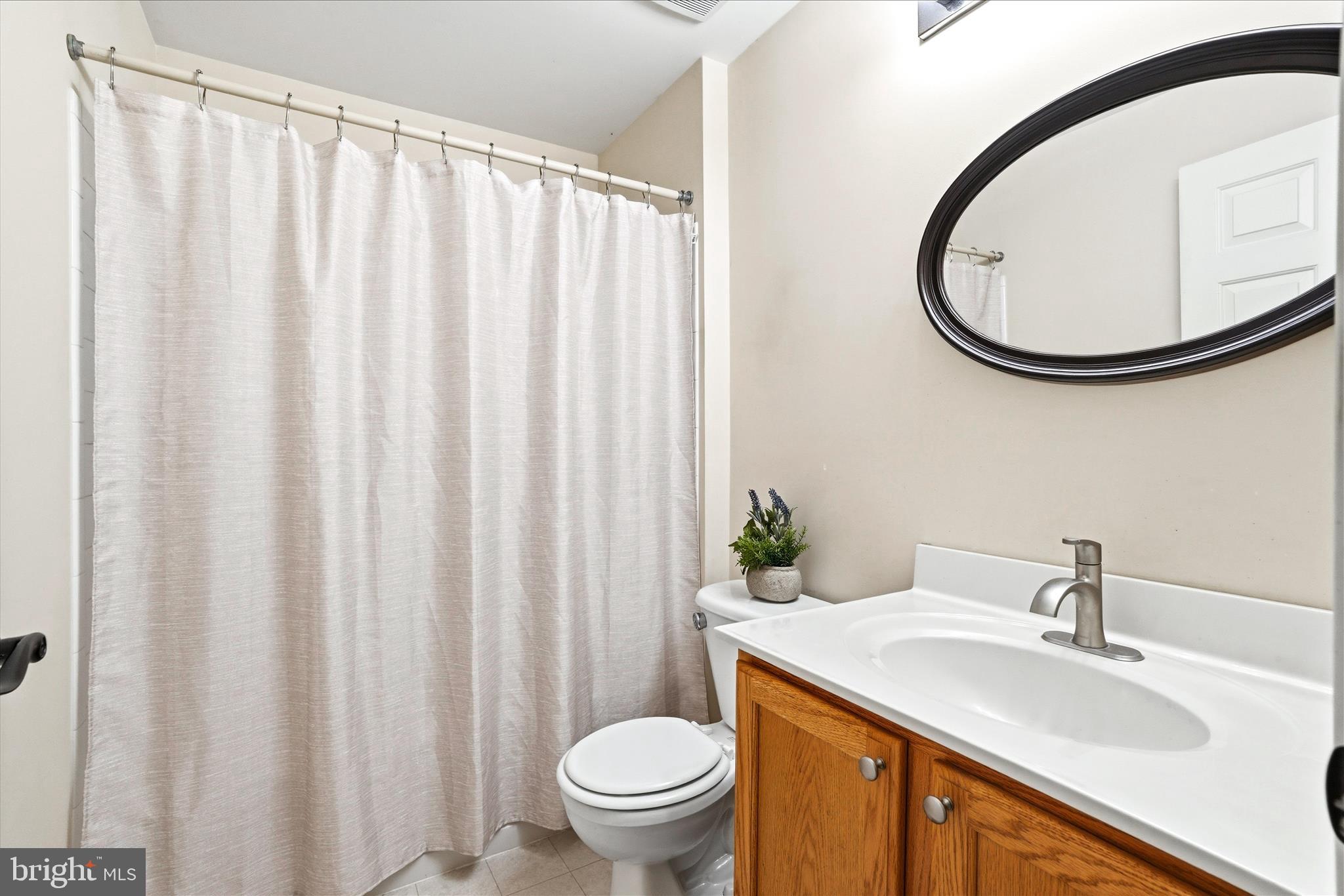 9009 Bealls Farm Road Frederick, MD 21704 - Photo 28 of 41 a bathroom with a sink a toilet and a mirror