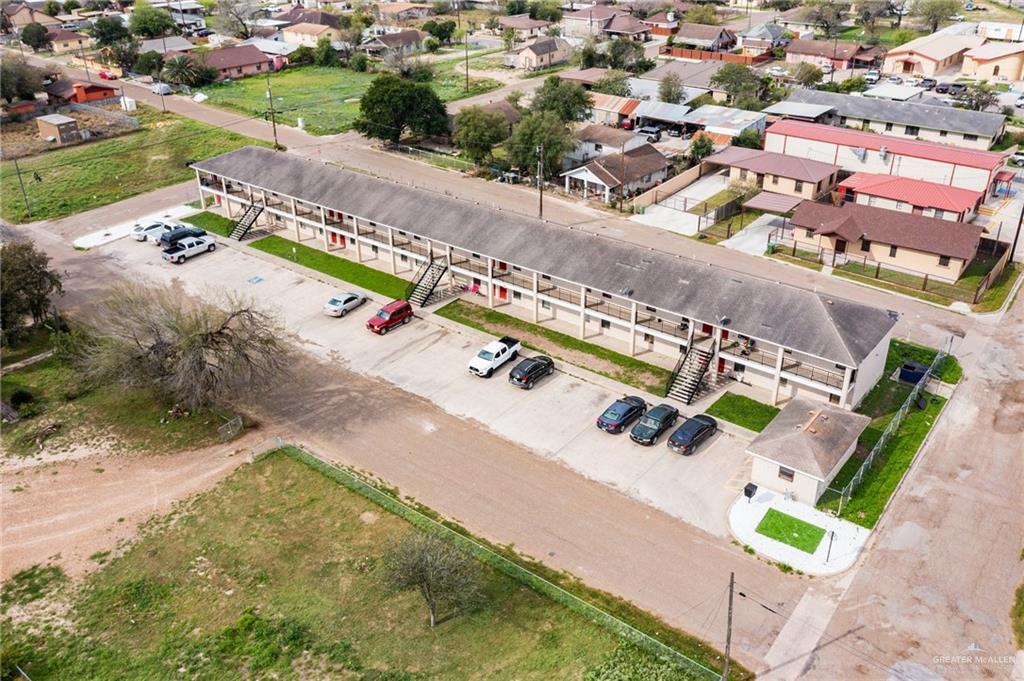 201 Fresno Avenue Roma, TX 78584 - Photo 14 of 20 an aerial view of a house with a yard and lake