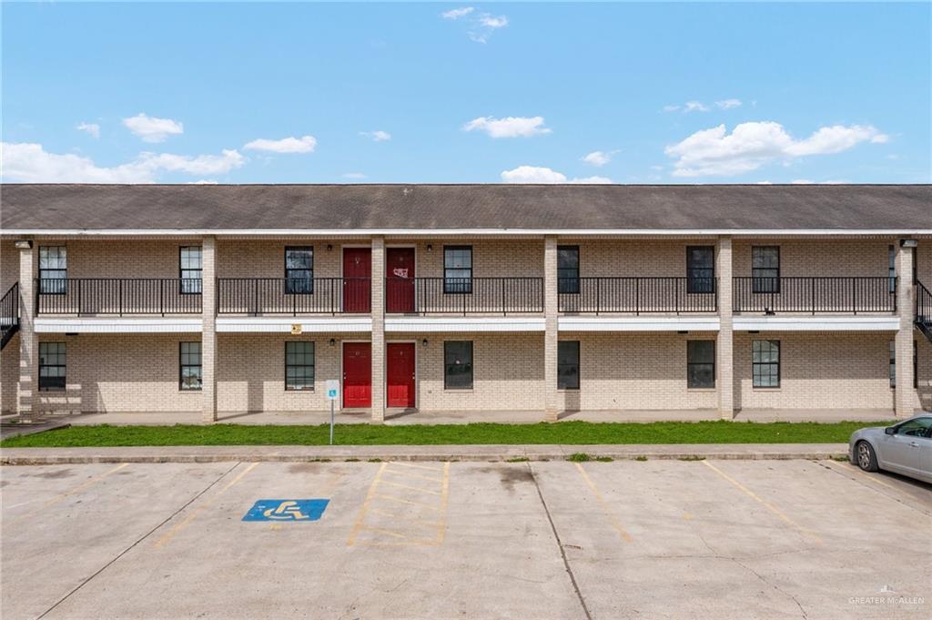 201 Fresno Avenue Roma, TX 78584 - Photo 2 of 20 a front view of building with a garden