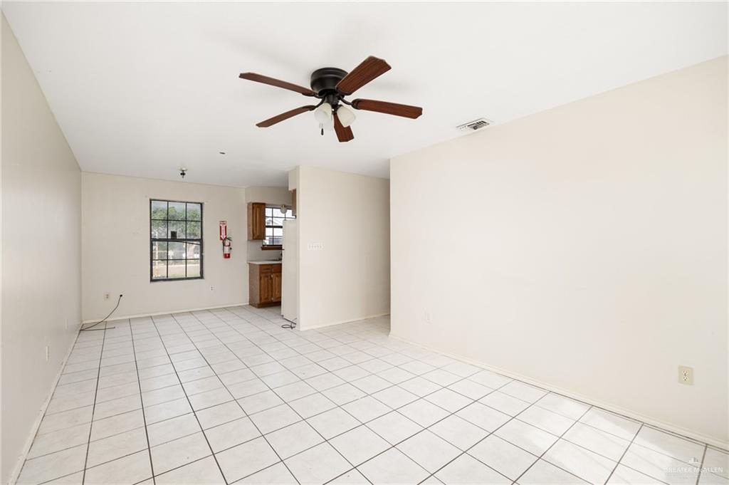 201 Fresno Avenue Roma, TX 78584 - Photo 4 of 20 a view of empty room with wooden floor