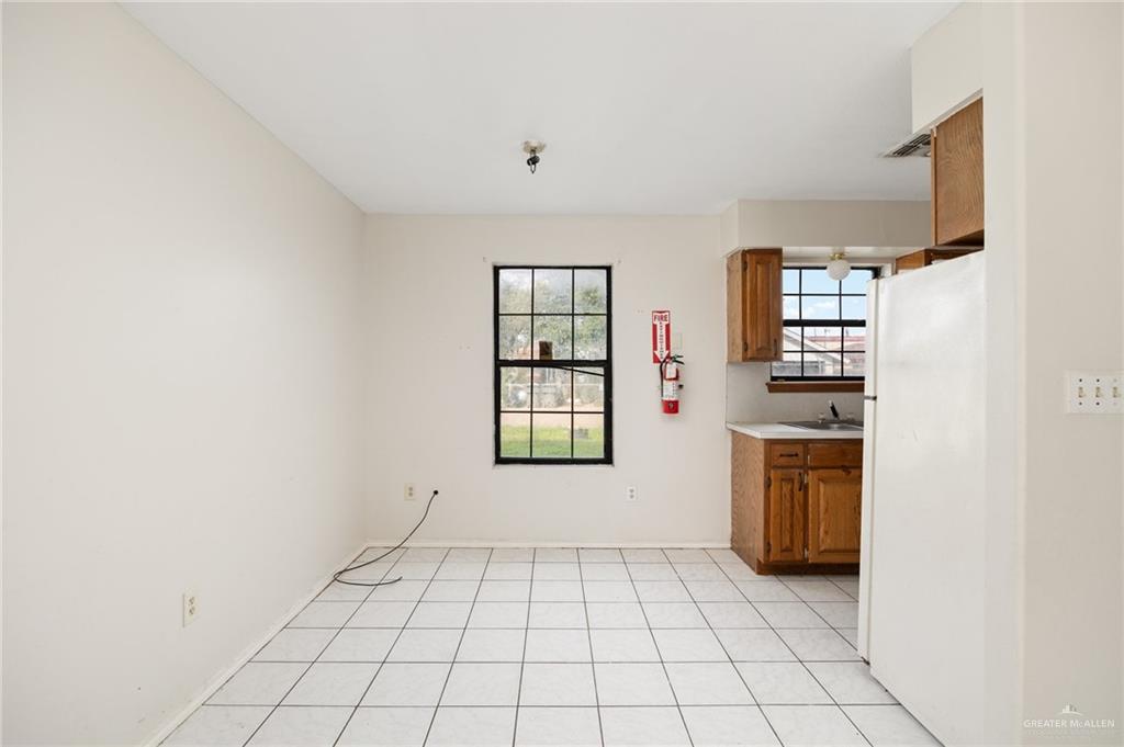 201 Fresno Avenue Roma, TX 78584 - Photo 5 of 20 a view of an empty room with a window