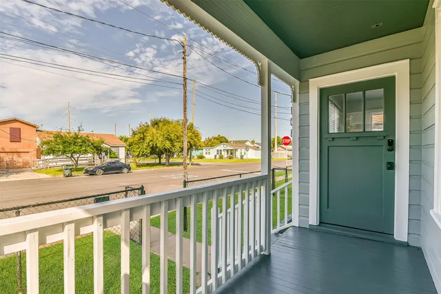 a kitchen with granite countertop a sink stainless steel appliances and window