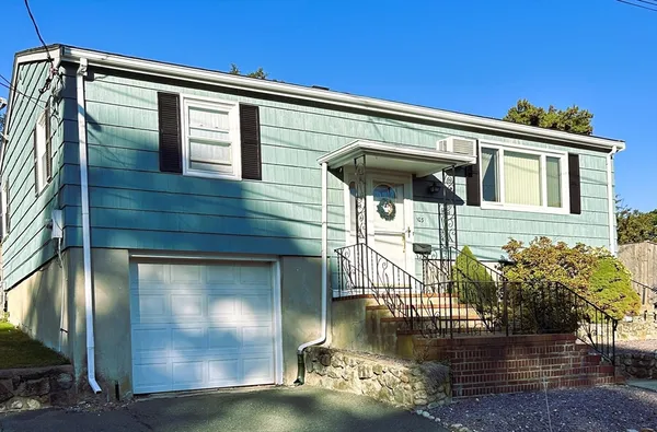 a front view of a house with lake view
