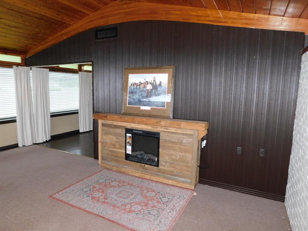 300 South Main Street Springhill, LA 71075 - Photo 15 of 35 a view of an empty room with a fireplace and a window
