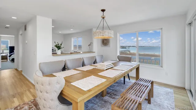 a living room with a couch and a chandelier
