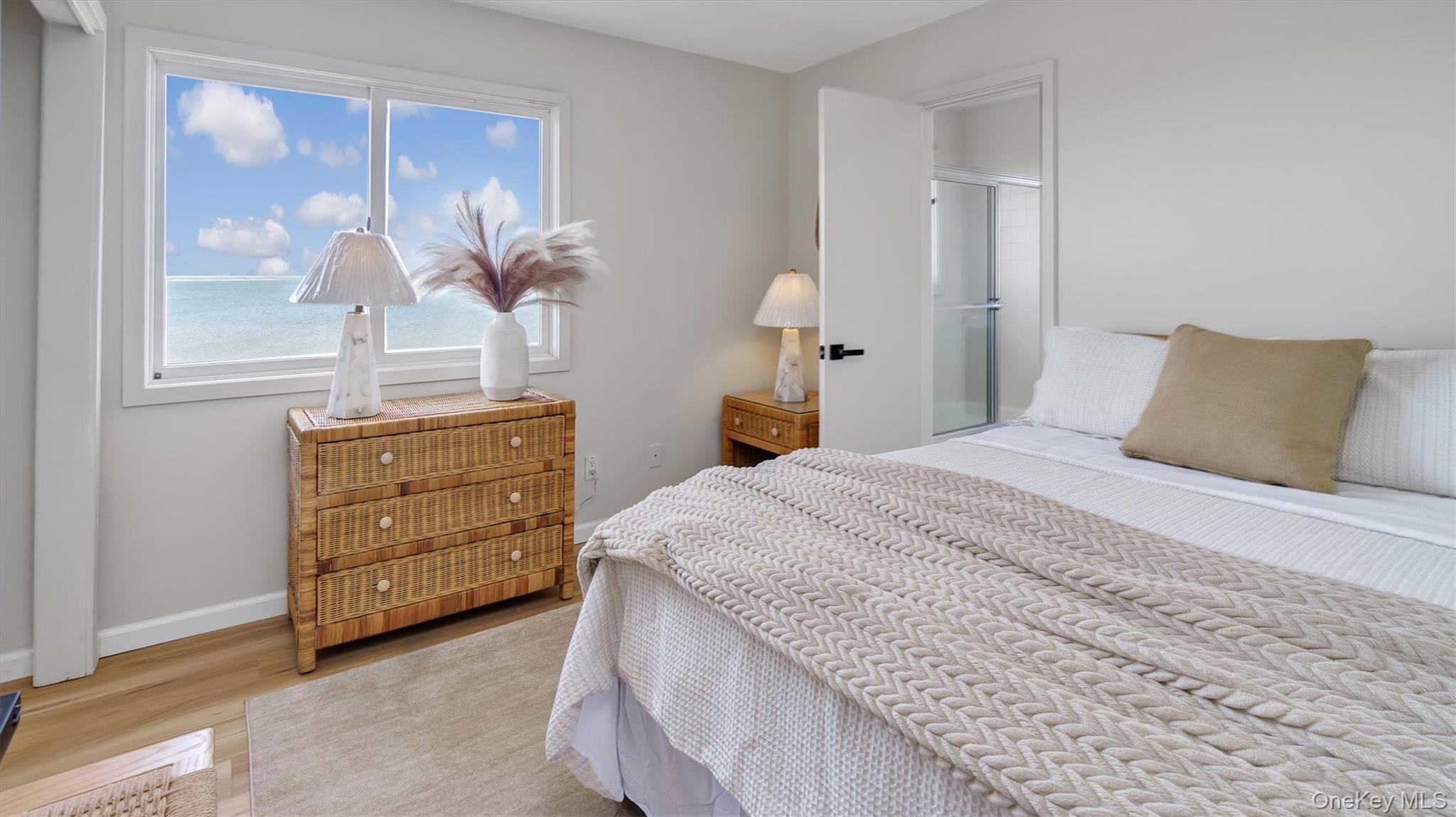 552 Dune Road Westhampton, NY 11978 - Photo 29 of 32 a bedroom with a bed and a dresser