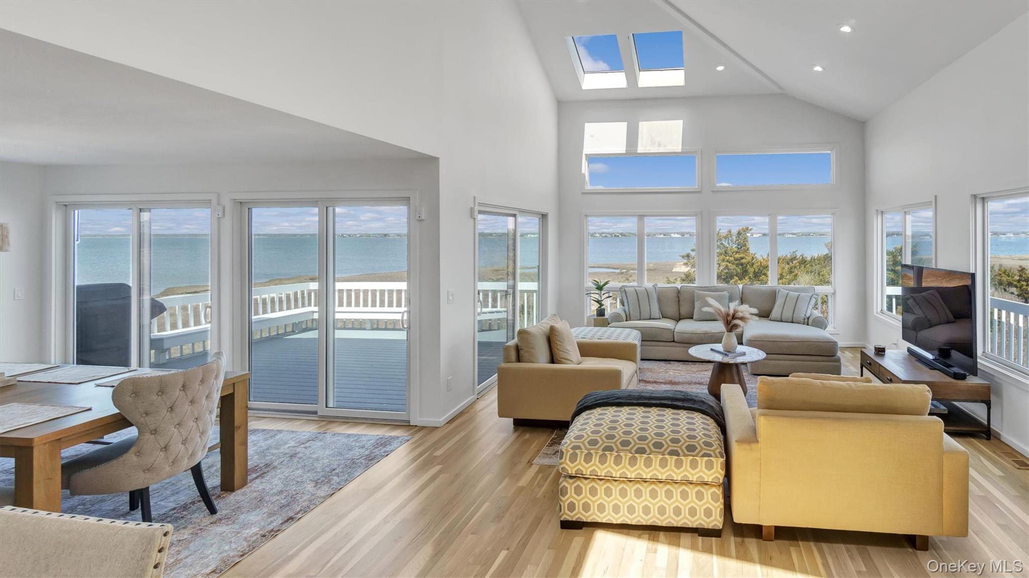 552 Dune Road Westhampton, NY 11978 - Photo 8 of 32 a living room with furniture fireplace and wooden floor