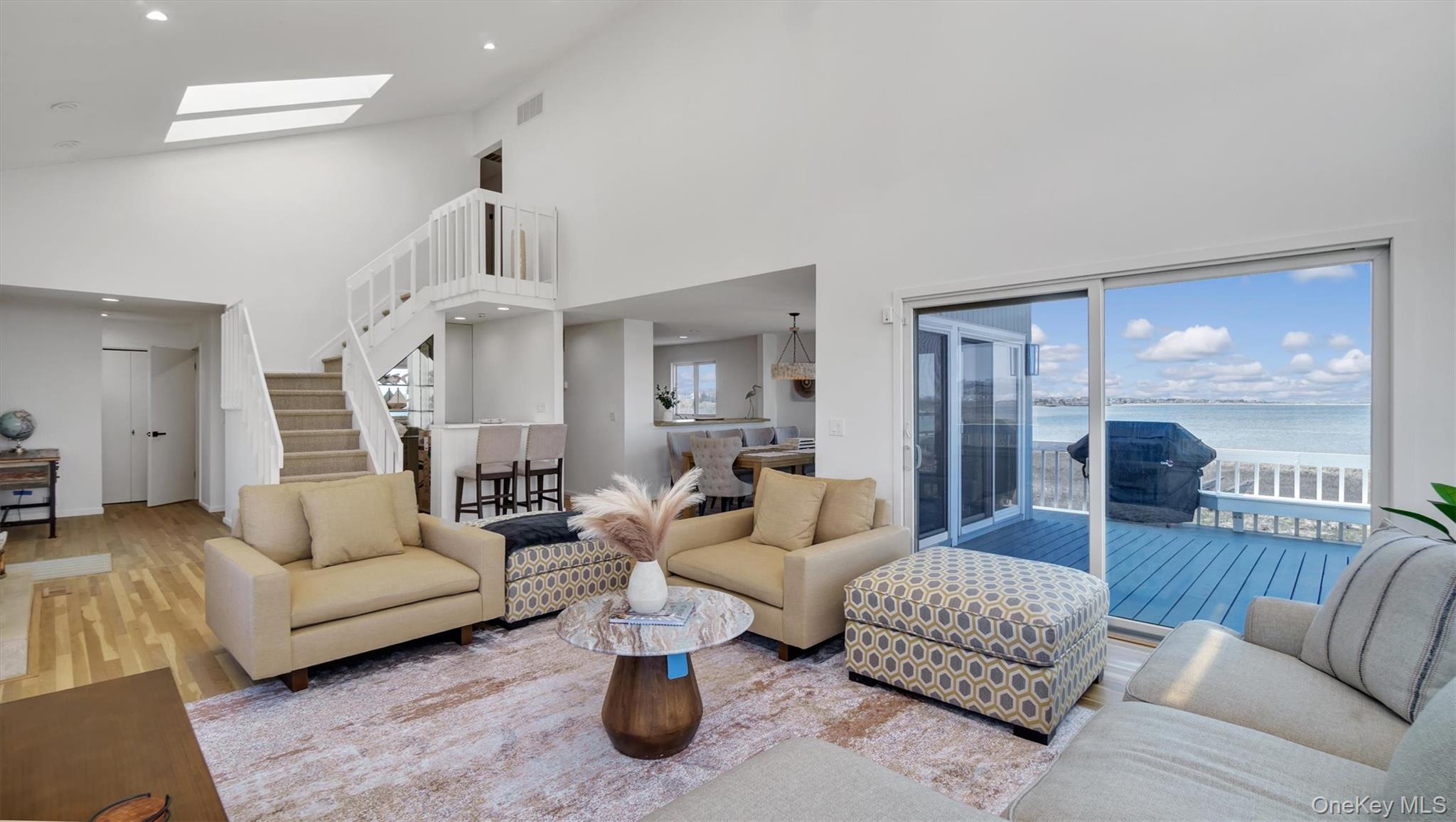 552 Dune Road Westhampton, NY 11978 - Photo 10 of 32 a living room with furniture or couch and a chandelier