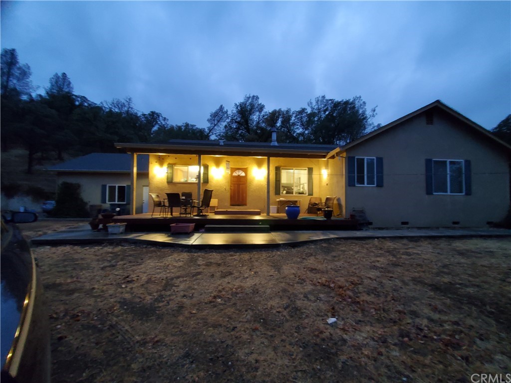 7477 White Oak Road Corning, CA 96021 - Photo 1 of 1 a view of a house with swimming pool and a yard