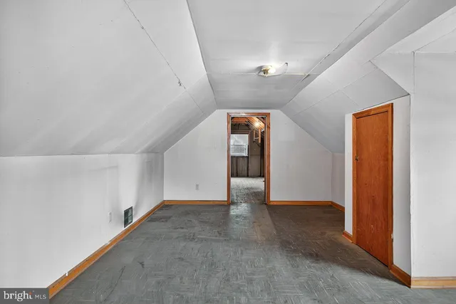 a view of an empty room and closet area