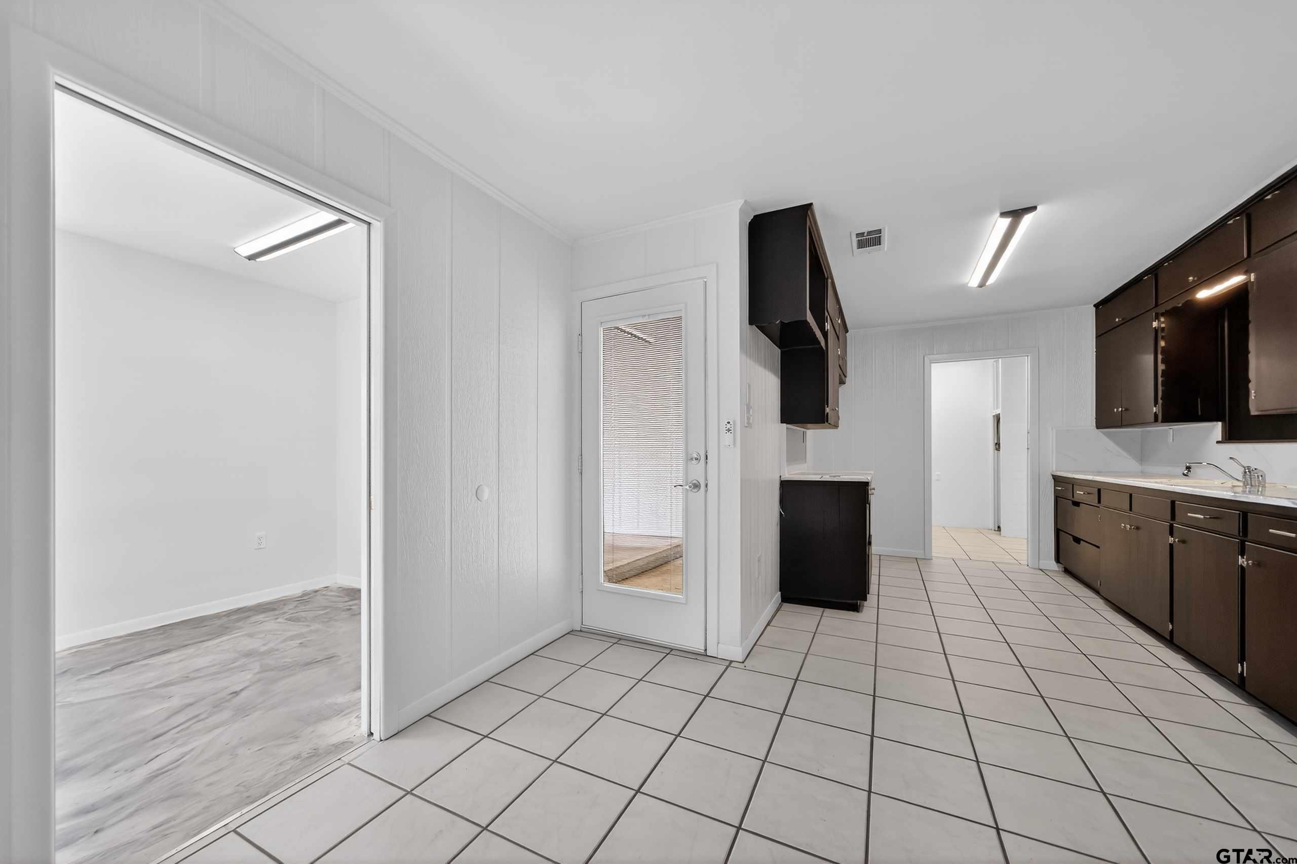 11457 State Highway 64 Tyler, TX 75707 - Photo 20 of 43 a view of an empty room with a fireplace and a window