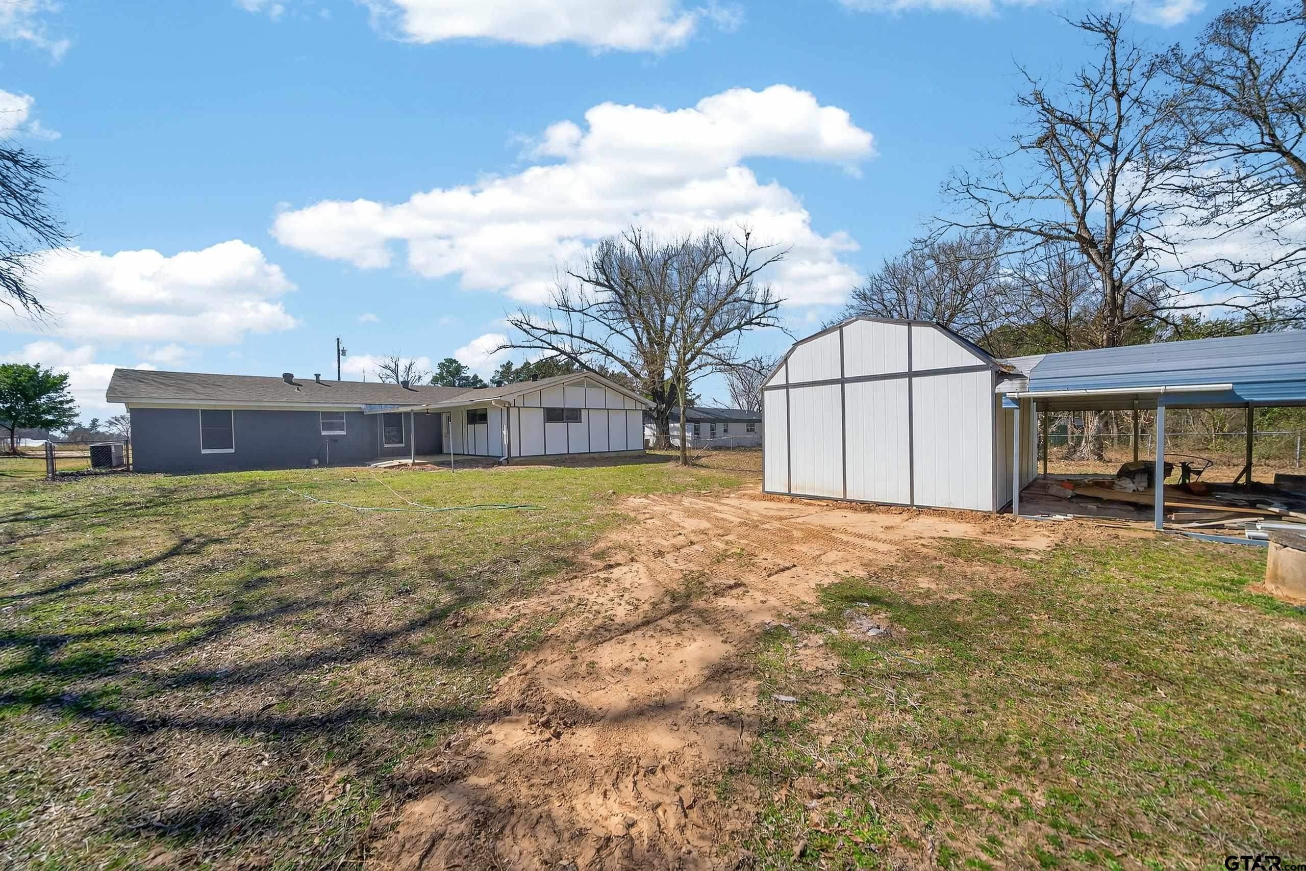 11457 State Highway 64 Tyler, TX 75707 - Photo 39 of 43 a view of a house with a yard