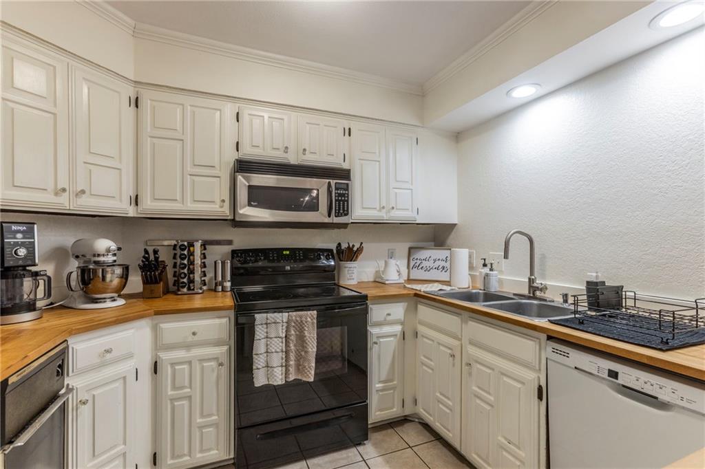 2307 Melissa Drive Waco, TX 76708 - Photo 6 of 23 a kitchen with stainless steel appliances granite countertop a sink a stove and cabinets