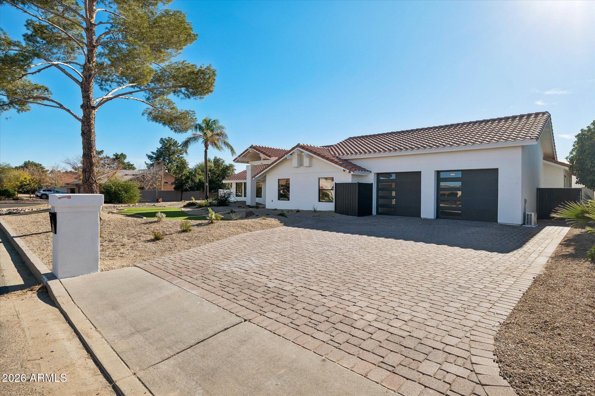 5861 East St John Road Scottsdale, AZ 85254 - Photo 9 of 60 a front view of a house with a yard