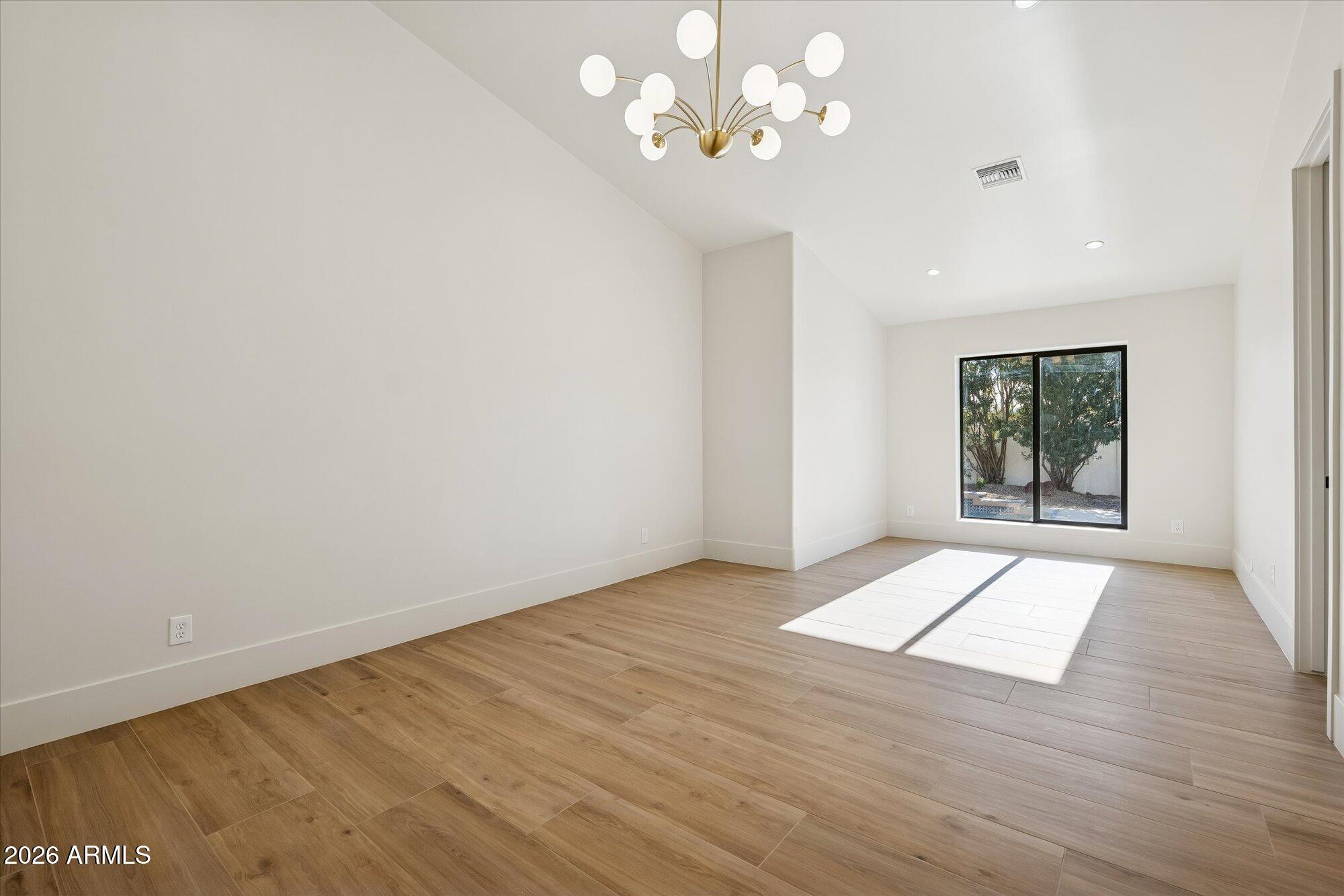 5861 East St John Road Scottsdale, AZ 85254 - Photo 25 of 60 wooden floor in an empty room with a window