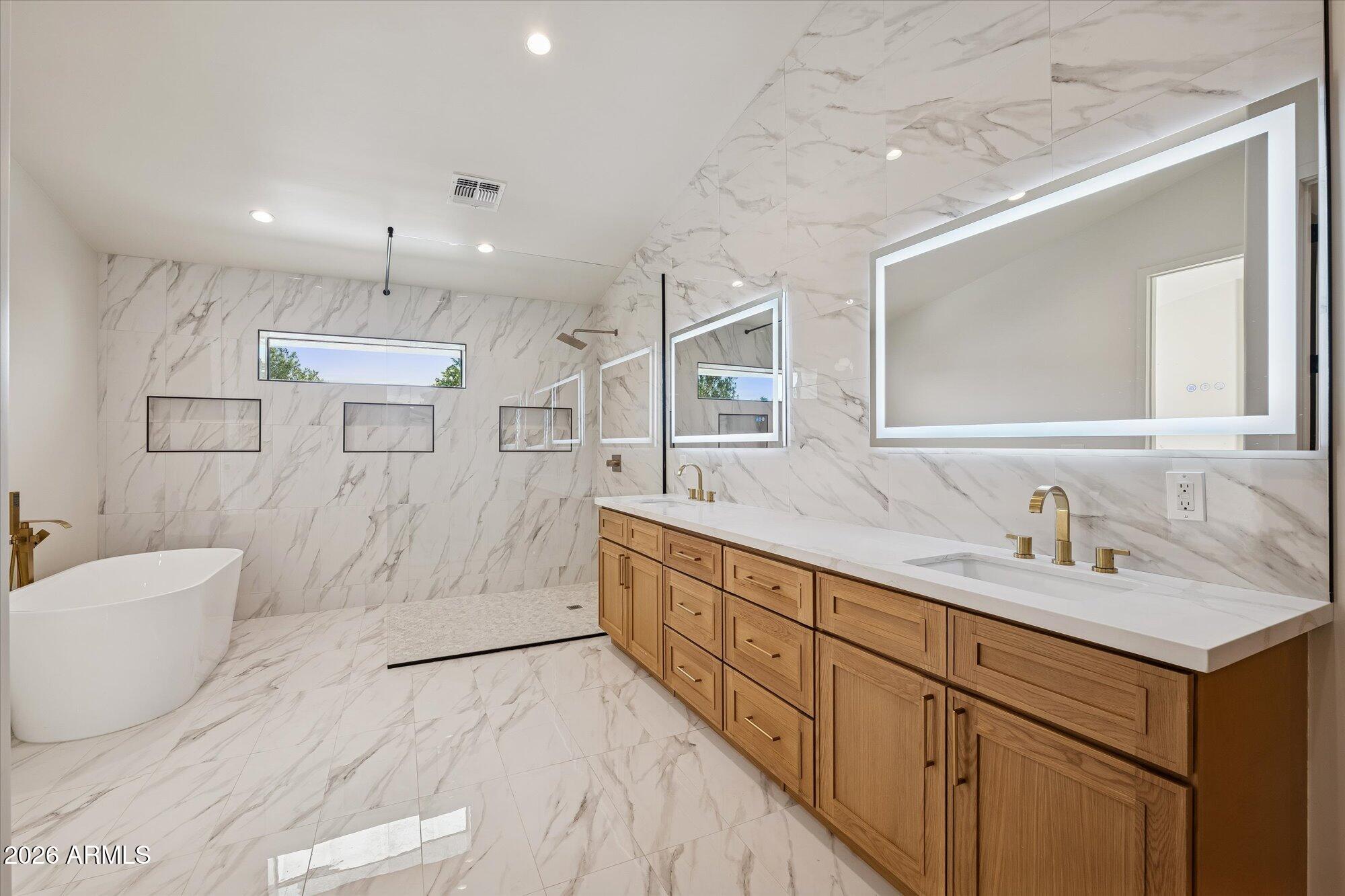 5861 East St John Road Scottsdale, AZ 85254 - Photo 2 of 60 a spacious bathroom with a double vanity sink a mirror and a shower