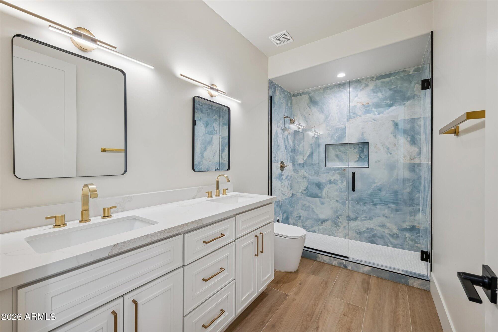 5861 East St John Road Scottsdale, AZ 85254 - Photo 32 of 60 a bathroom with a double vanity sink mirror double and shower