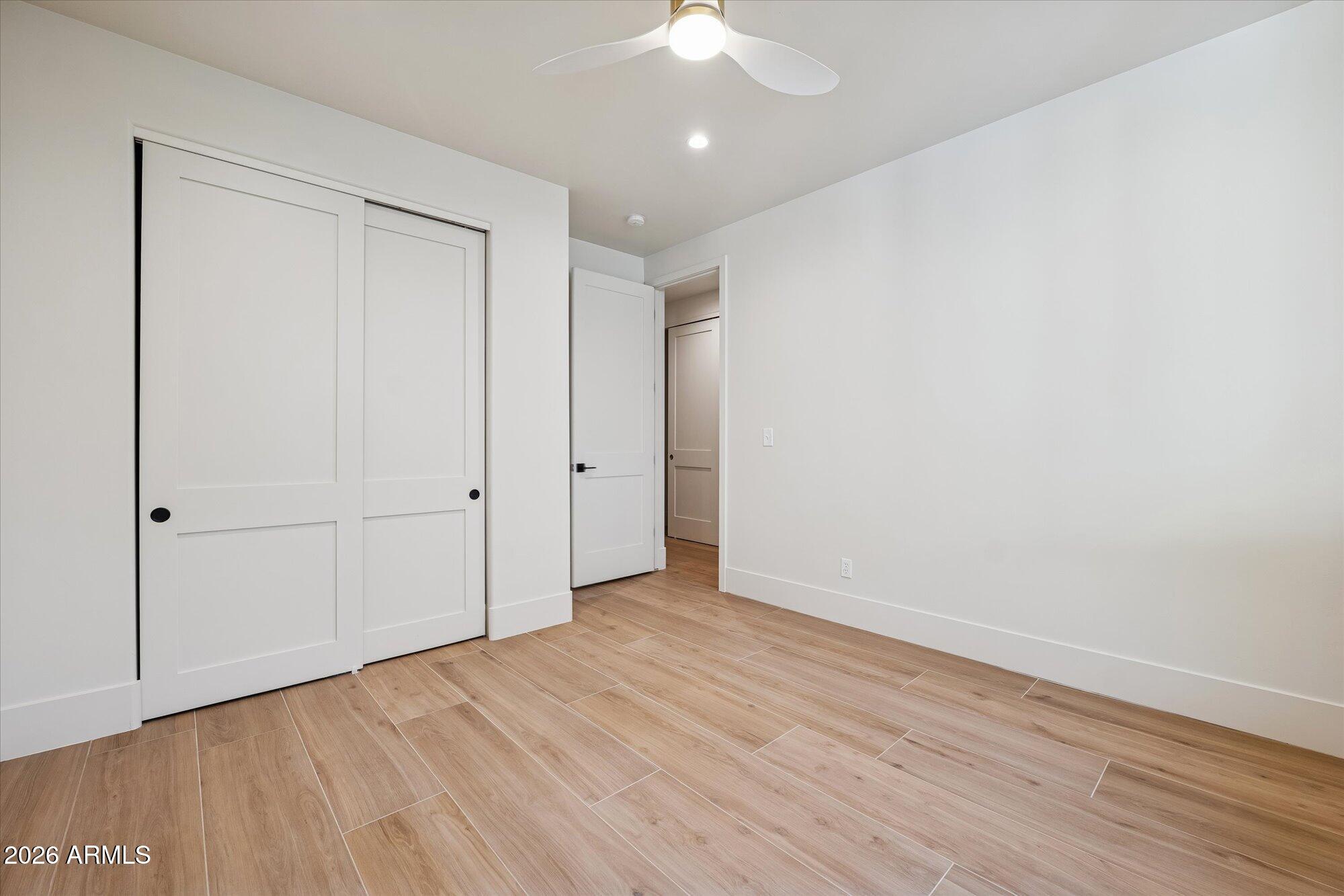 5861 East St John Road Scottsdale, AZ 85254 - Photo 38 of 60 a view of an empty room with wooden floor