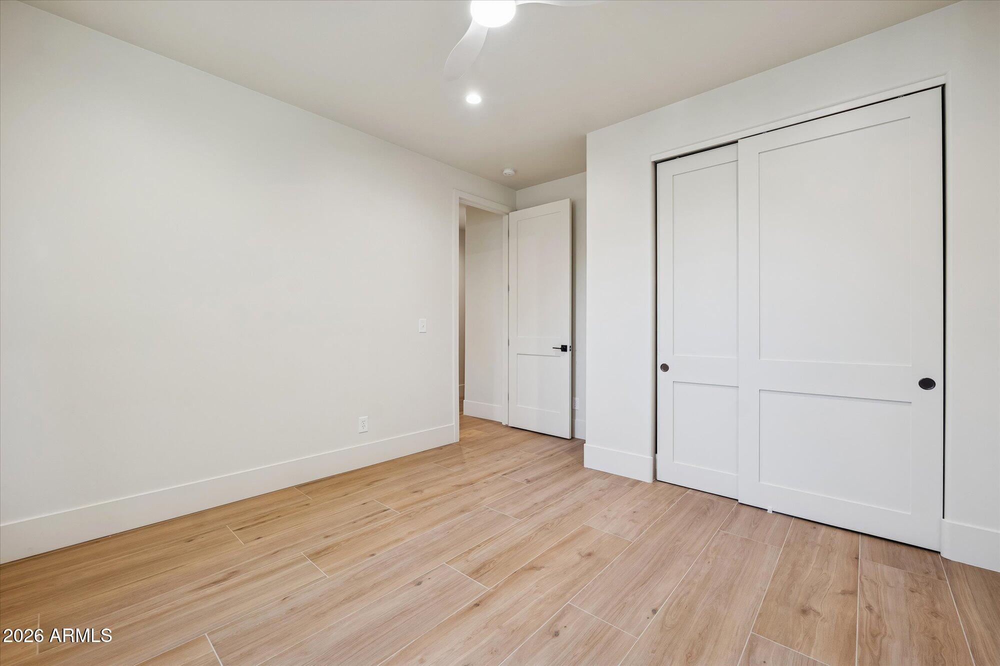5861 East St John Road Scottsdale, AZ 85254 - Photo 41 of 60 a view of an empty room with wooden floor