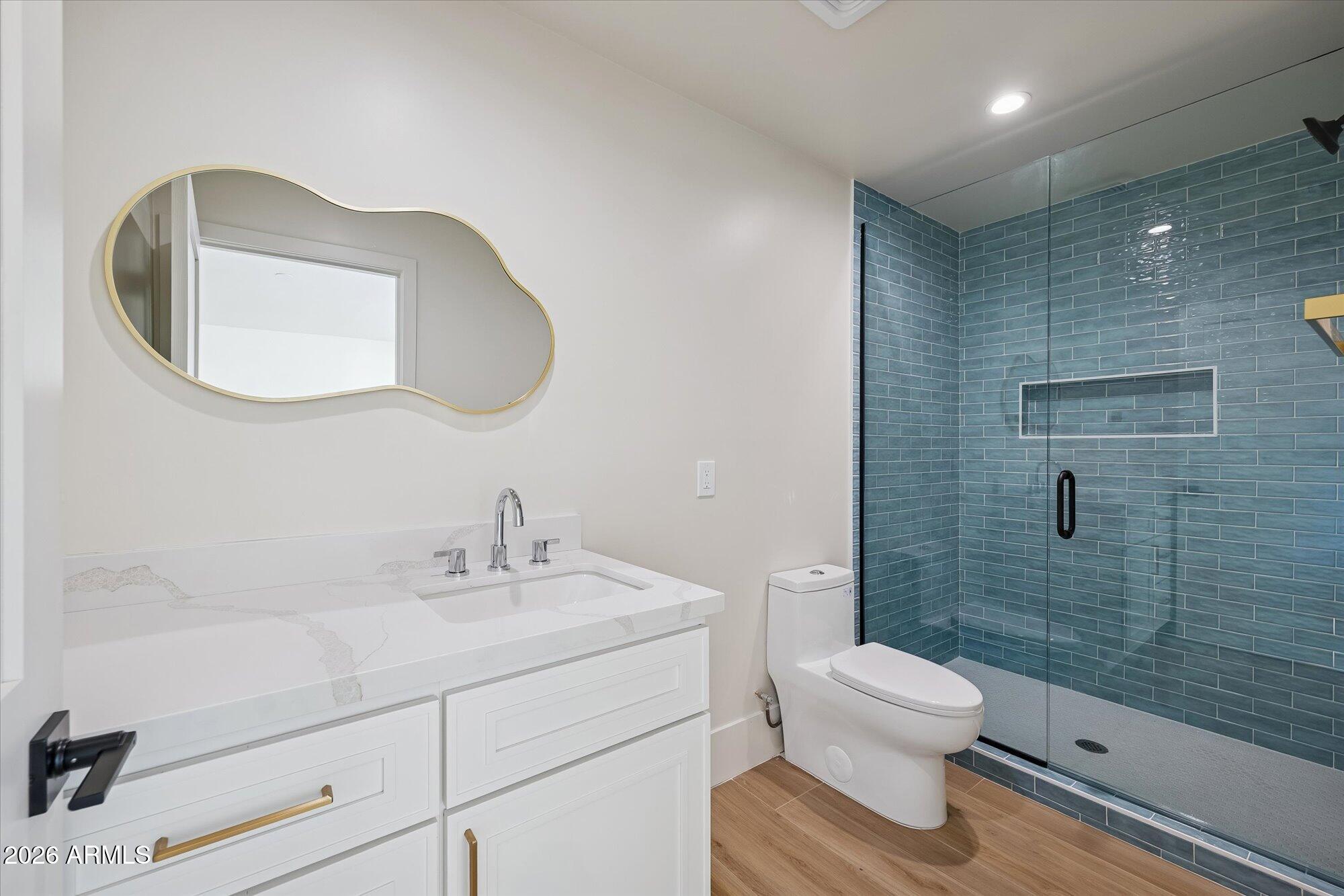 5861 East St John Road Scottsdale, AZ 85254 - Photo 43 of 60 a bathroom with a toilet sink and shower