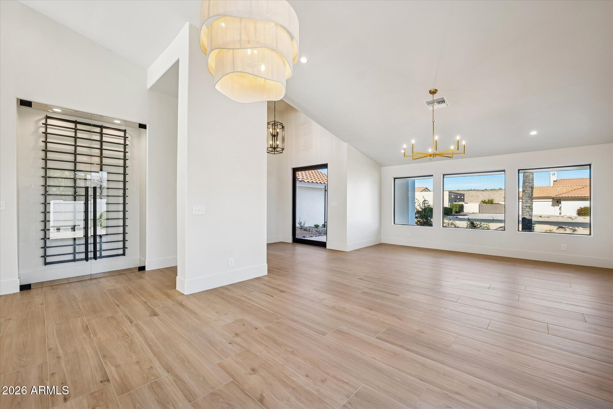 5861 East St John Road Scottsdale, AZ 85254 - Photo 3 of 60 an empty room with wooden floor and windows