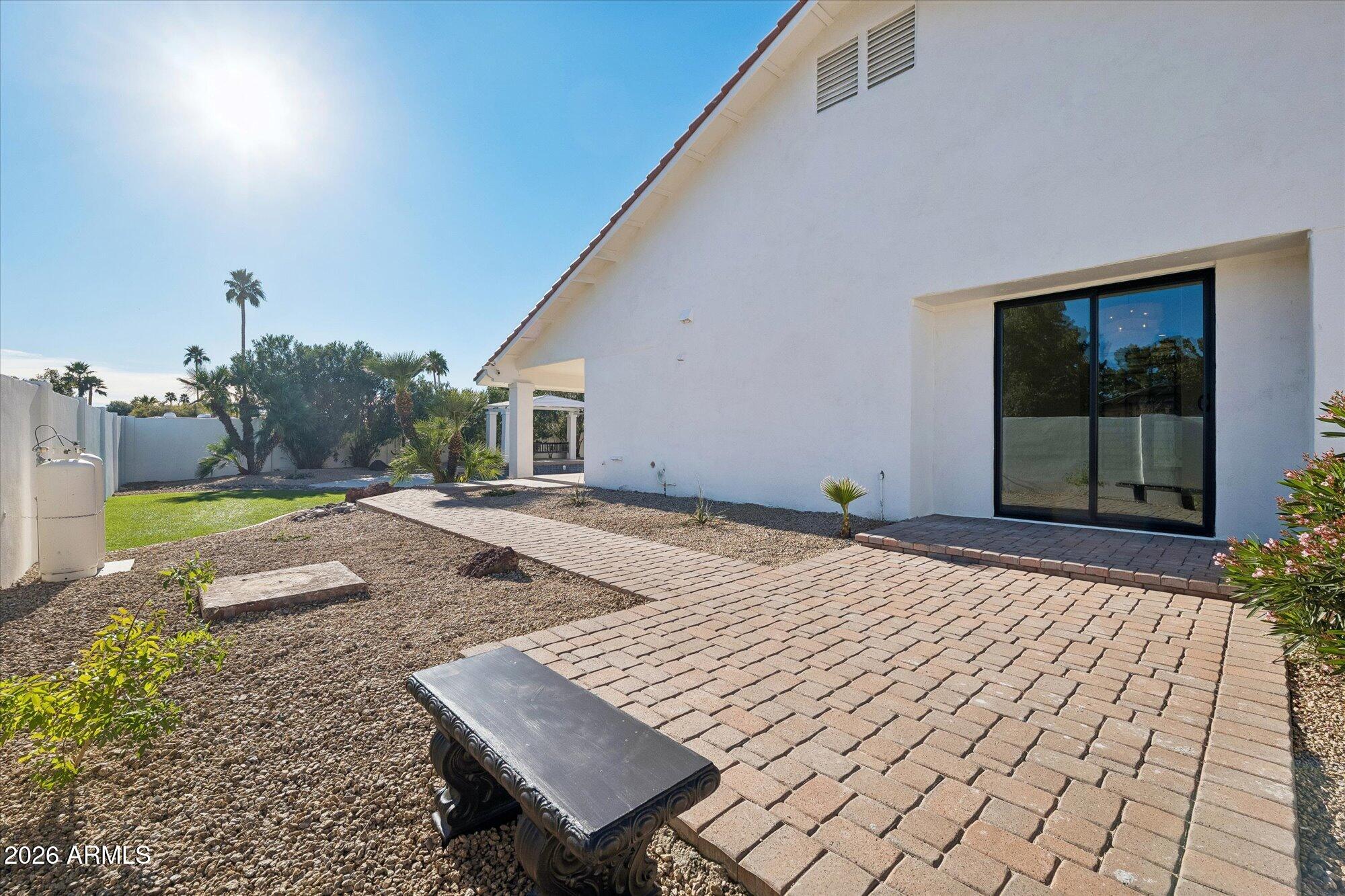 5861 East St John Road Scottsdale, AZ 85254 - Photo 46 of 60 a view of an house with backyard porch and furniture