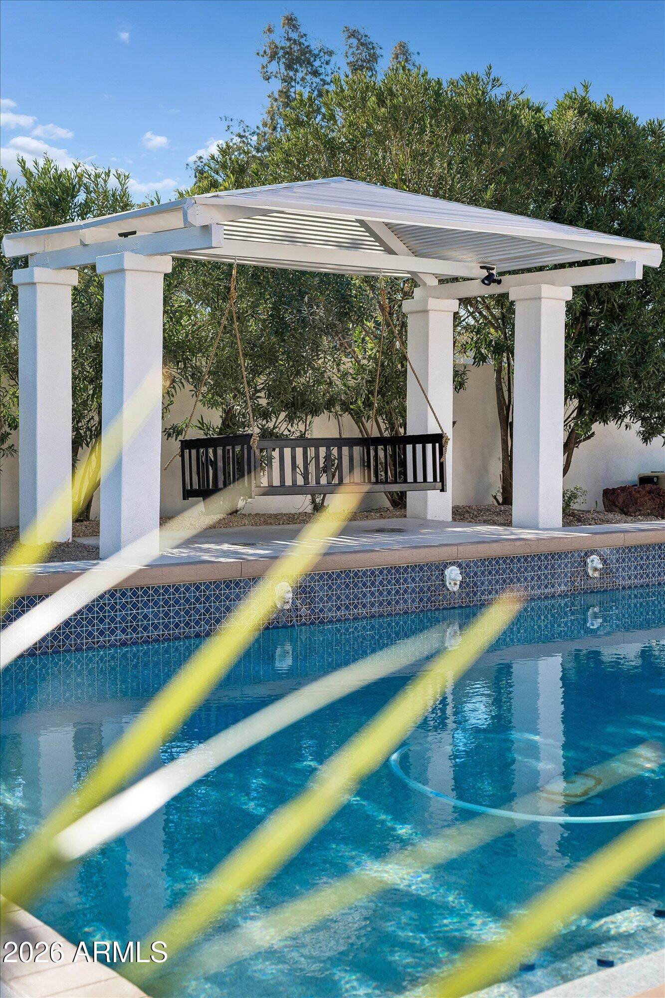 5861 East St John Road Scottsdale, AZ 85254 - Photo 53 of 60 a view of swimming pool with lawn chairs and plants