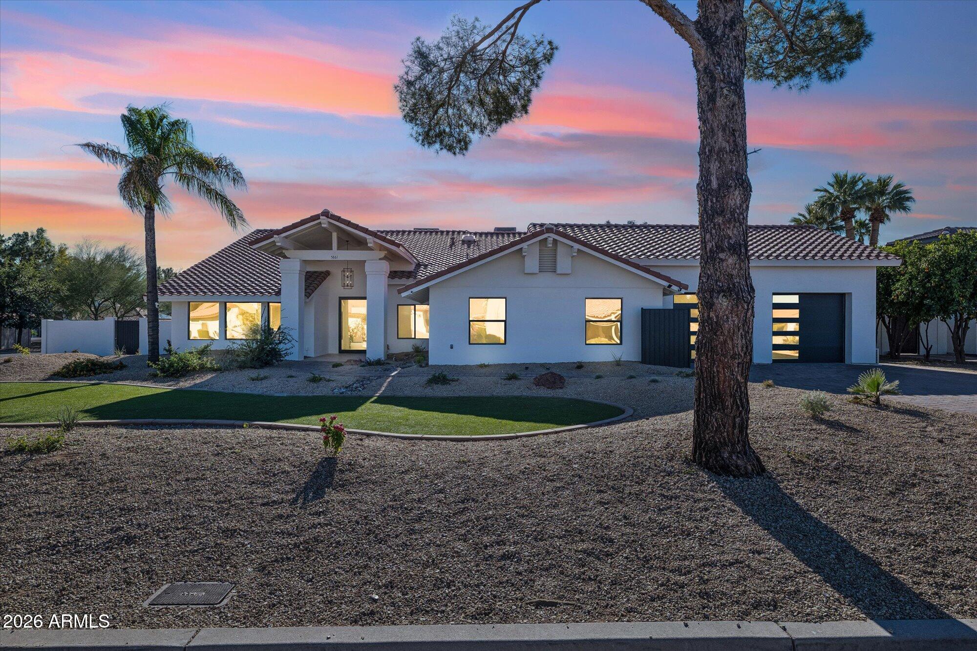 5861 East St John Road Scottsdale, AZ 85254 - Photo 55 of 60 a front view of a house with garden