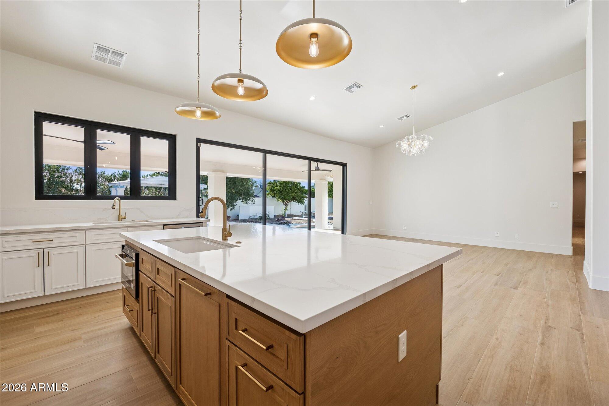 5861 East St John Road Scottsdale, AZ 85254 - Photo 4 of 60 a kitchen with a stove and a sink