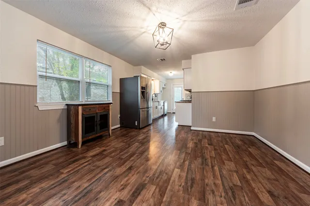 a view of a livingroom with wooden floor