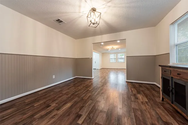 a view of a livingroom with wooden floor