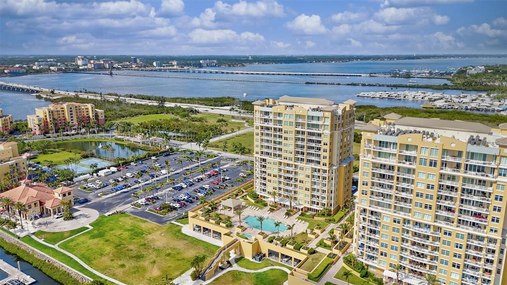 140 Riviera Dunes Way, Unit 206 Palmetto, FL 34221 - Photo 33 of 46 a view of a balcony with an outdoor space and seating area
