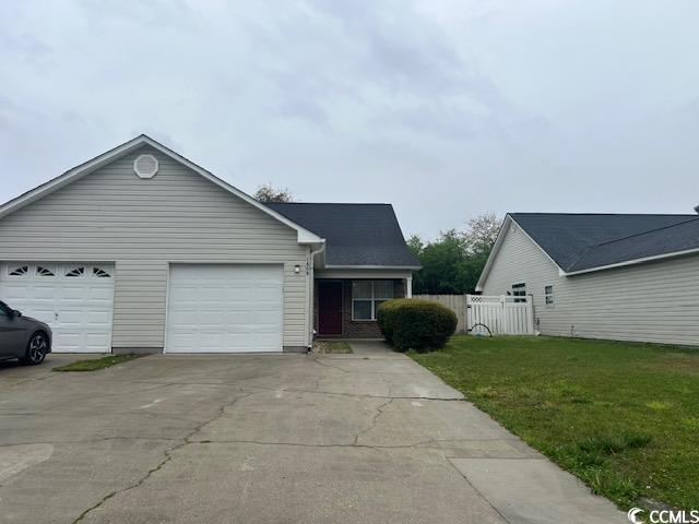 View of front facade with driveway, an attached ga