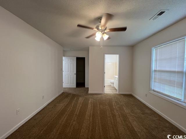 1809 Barberry Drive Conway, SC 29526 - Photo 14 of 16 Unfurnished bedroom featuring baseboards, a textur