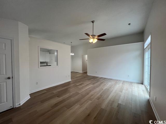 1809 Barberry Drive Conway, SC 29526 - Photo 2 of 16 Unfurnished living room featuring wood finished fl