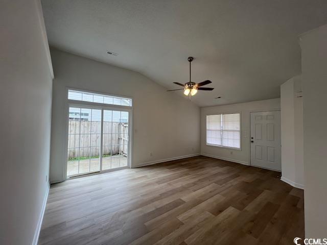1809 Barberry Drive Conway, SC 29526 - Photo 4 of 16 Empty room with baseboards, ceiling fan, wood fini