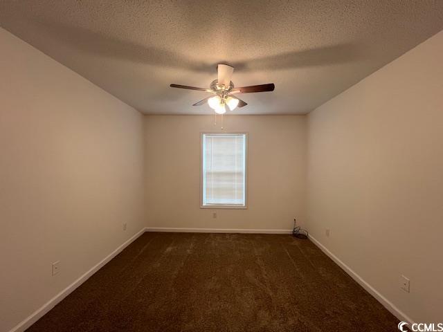 1809 Barberry Drive Conway, SC 29526 - Photo 10 of 16 Spare room featuring baseboards, a textured ceilin