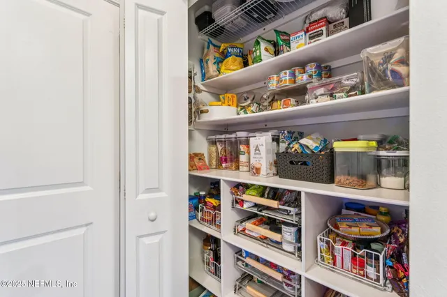 a shelf with books and knick knacks on it