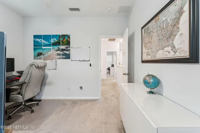 a view of workspace with a couch