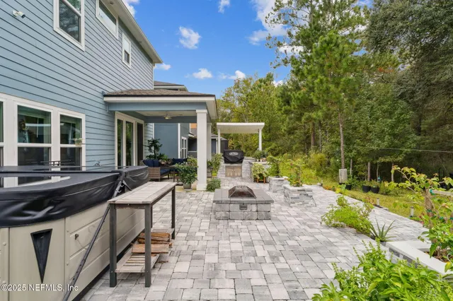 a backyard of a house with outdoor seating