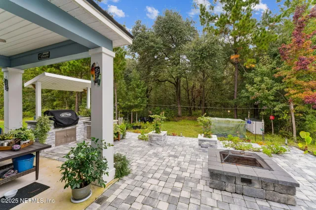 a view of a swimming pool with a yard and deck