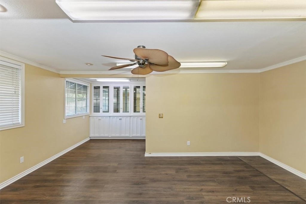 18590 Roberts Road Riverside, CA 92508 - Photo 19 of 66 a view of an empty room with wooden floor and a window