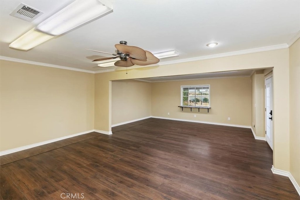18590 Roberts Road Riverside, CA 92508 - Photo 21 of 66 an empty room with wooden floor and windows