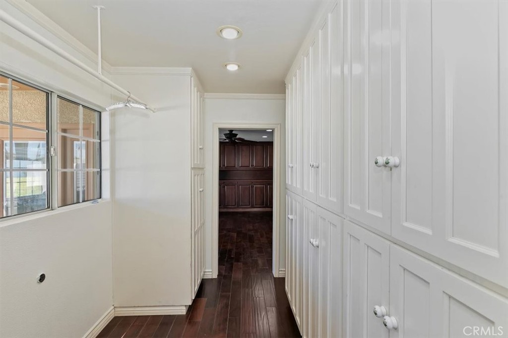 18590 Roberts Road Riverside, CA 92508 - Photo 22 of 66 a view of a hallway with wooden floor and closet
